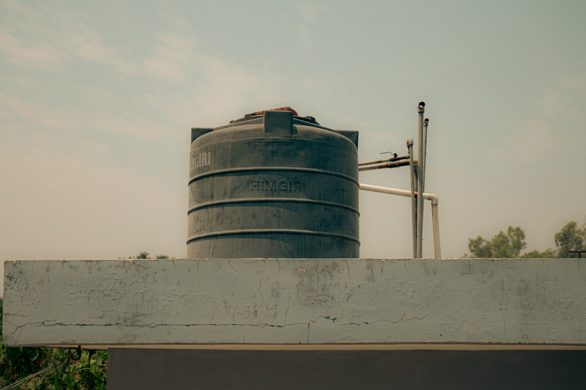 Aerial view of water treatment facility with settling basins