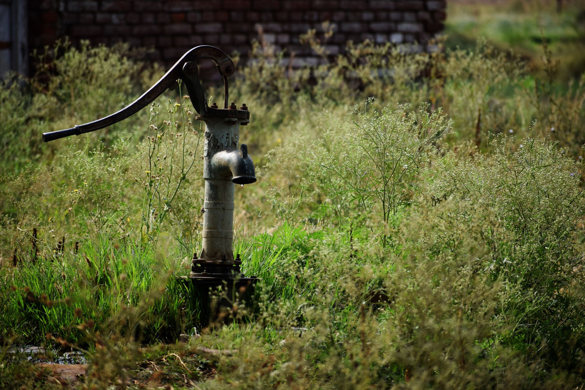 Small 12 volt water pump plumbed inside an off grid cabin