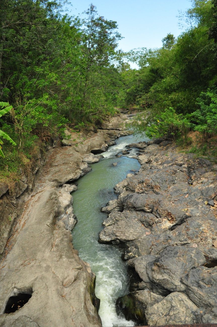 Limestone rock formation with a stream of water running over the calcium-rich stone.